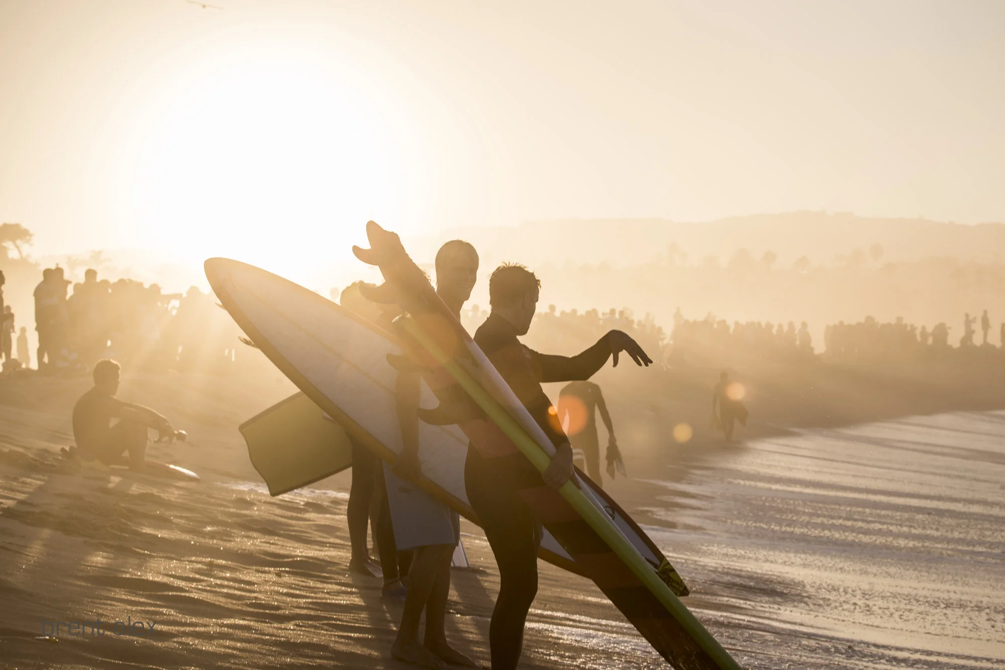 Hawaiian Jamie O'Brien and South Bay nativeScotty Bredesen share strategy on the shoreline. 