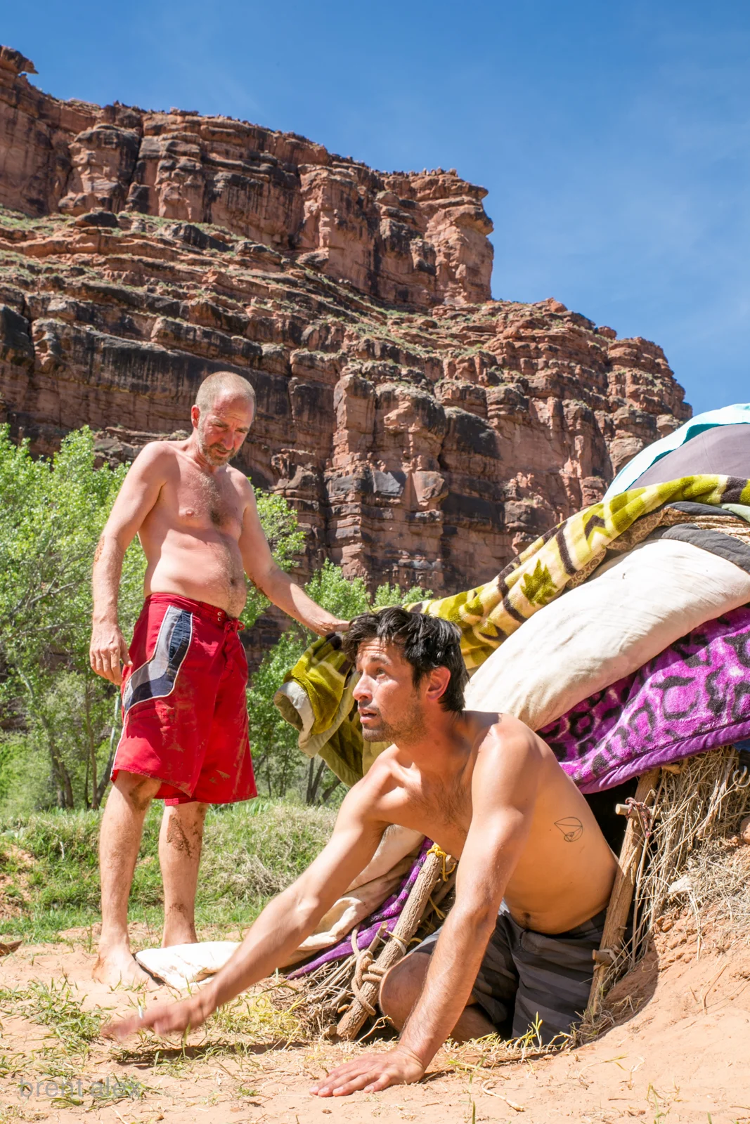 (L) Craig pulls open the door for a participant entering his first sweat ceremony 