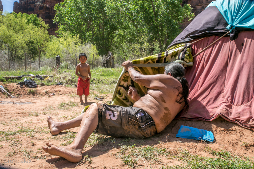 (R) Roland plays with his nephew Seamus outside the sweat lodge.