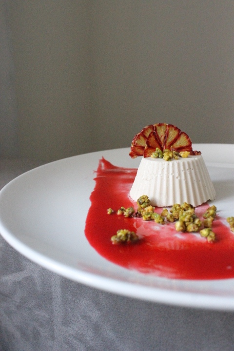 Vanilla Panna Cotta. I made my own sauce of blood orange, strawberry and raspberry sauce with cardamom and orange zest.