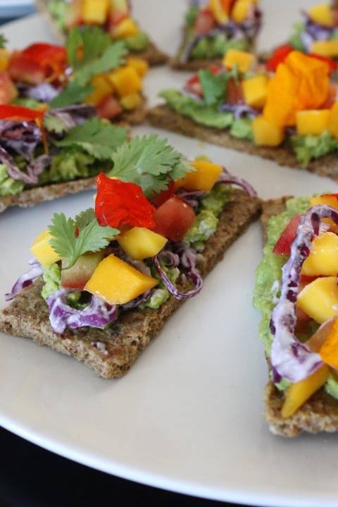 Hawaiian Toast. Raw Almond Bread. Avocado. Purple Cabbage. Mango Salsa. Herbs. Edible Flowers. Cashew Cream.
