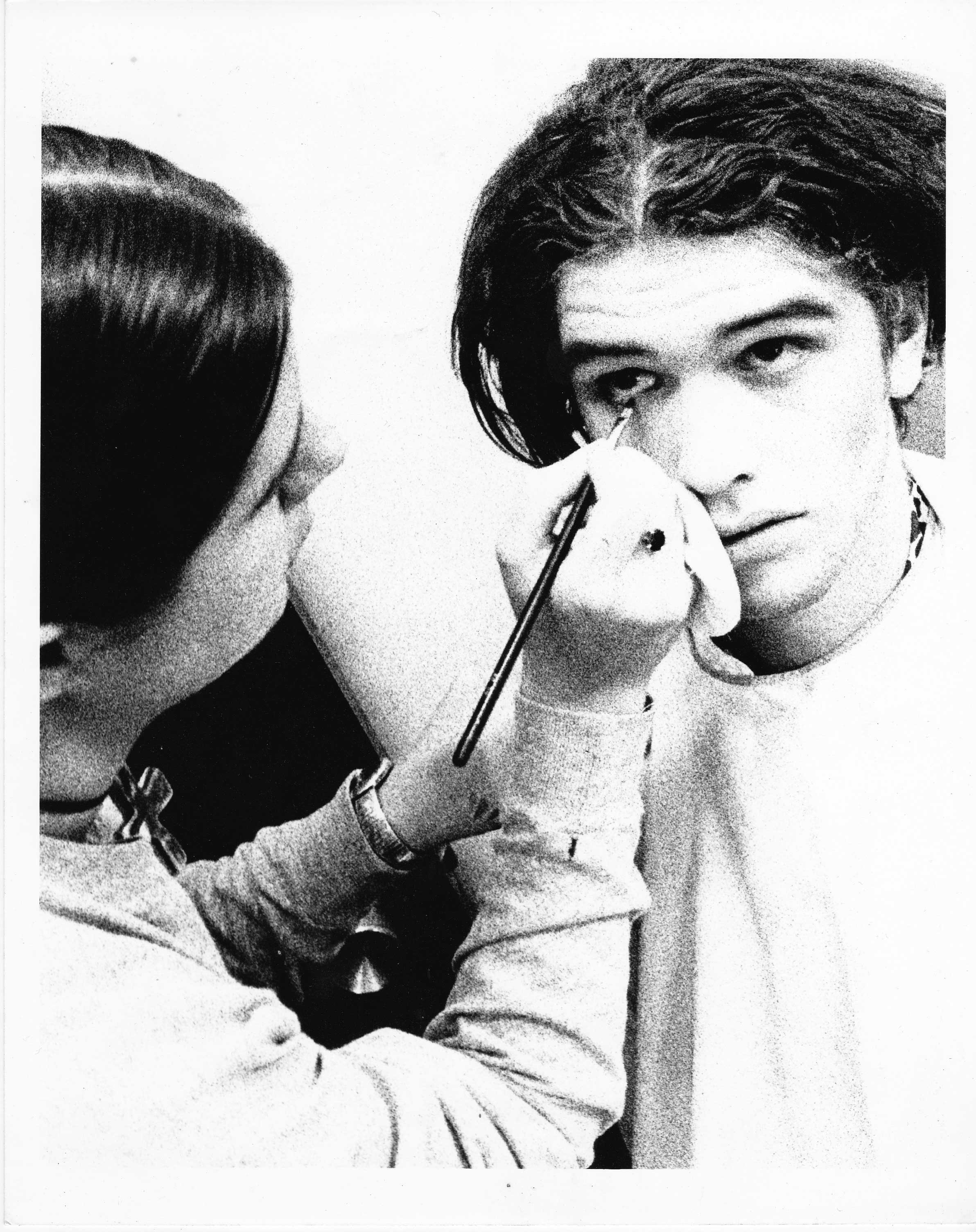 Makeup artist Suzanne Styche applying Torben Tilly.