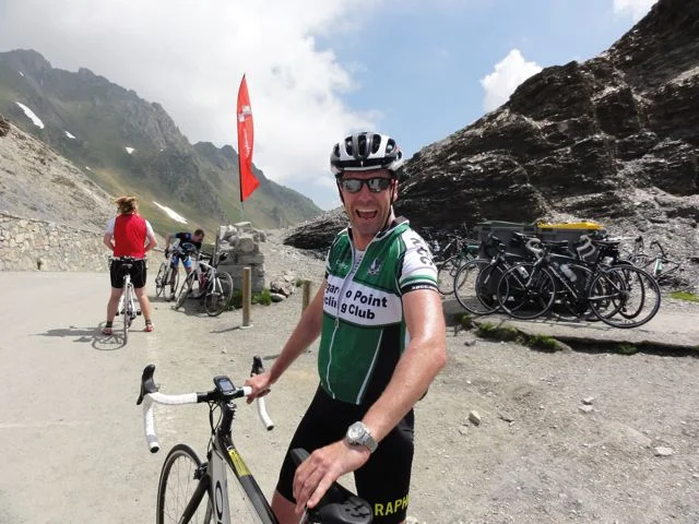 Aaron looks pleased to have made the top of Col du Tourmalet!
