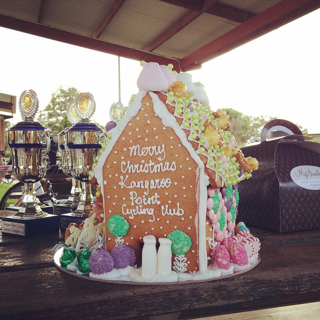 MySweetopia dropped by the racing to present the Club with a Gingerbread house!