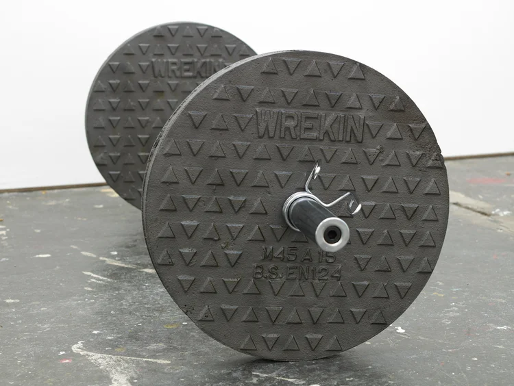 Wreckin' Cru (detail)2012 Cast iron manhole covers, stainless steel bar and metal fittings 19.5 x 19.5 x 60 inches