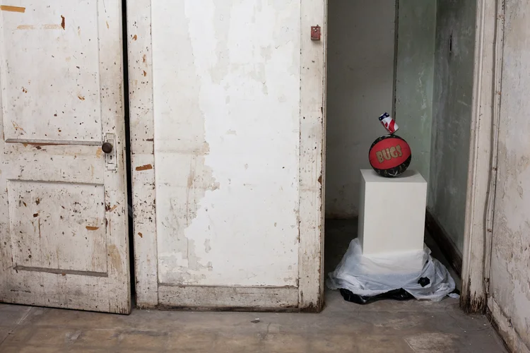 Dylan Lynch Untitled (Bugs Beer) 2011 Partially drunk beer can on basketball, wood, trash bags 26 x 26 x 40 inches