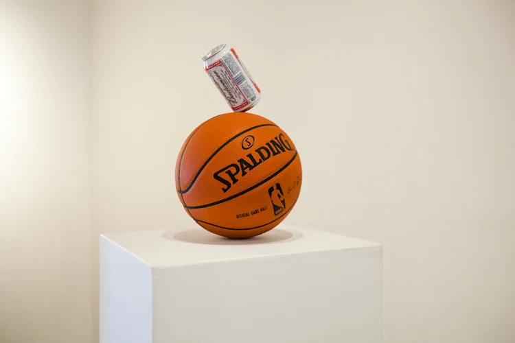 Dylan LynchGettin’ Buff 2011 Partially drank beer can balanced on basketball Variable 