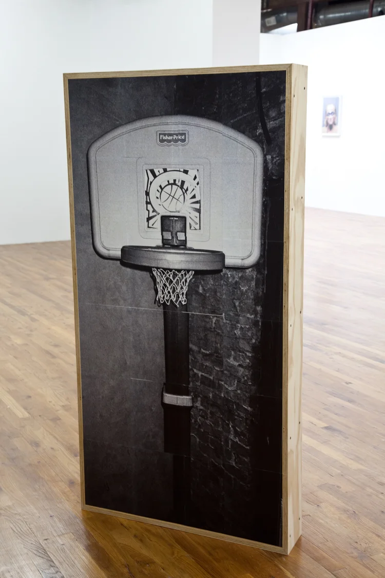 East Village: Basketball Hoop/Fire Extinguisher (front) 2012 Tiled photograph, wood panel, wood frame, gel medium, screws 61 1/2 x 31 1/2 x 6 inches