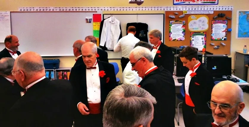 Dressing room preparation before Northeastern District contest