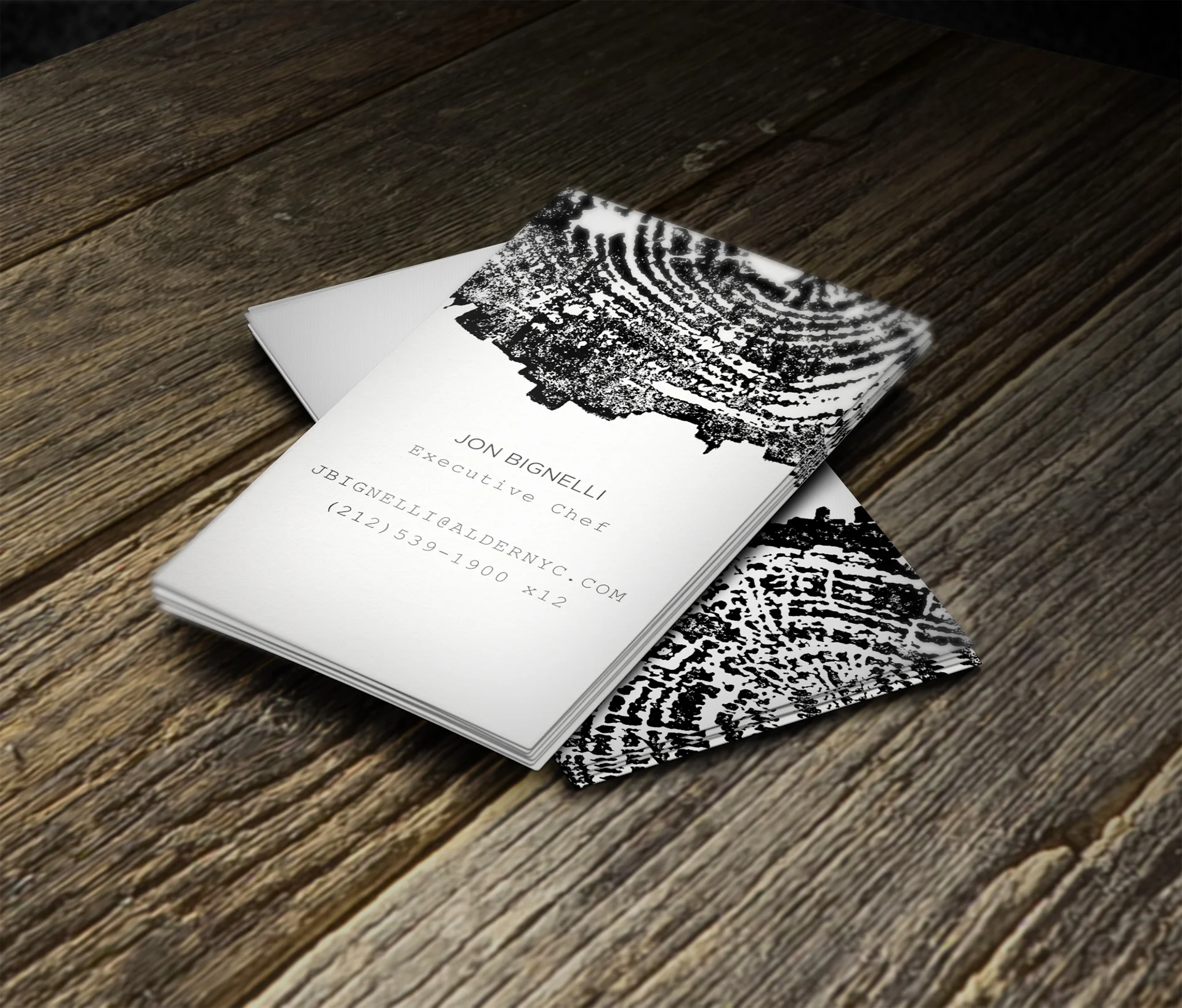 Business cards - The business cards are elegant black and white with sparse typography.