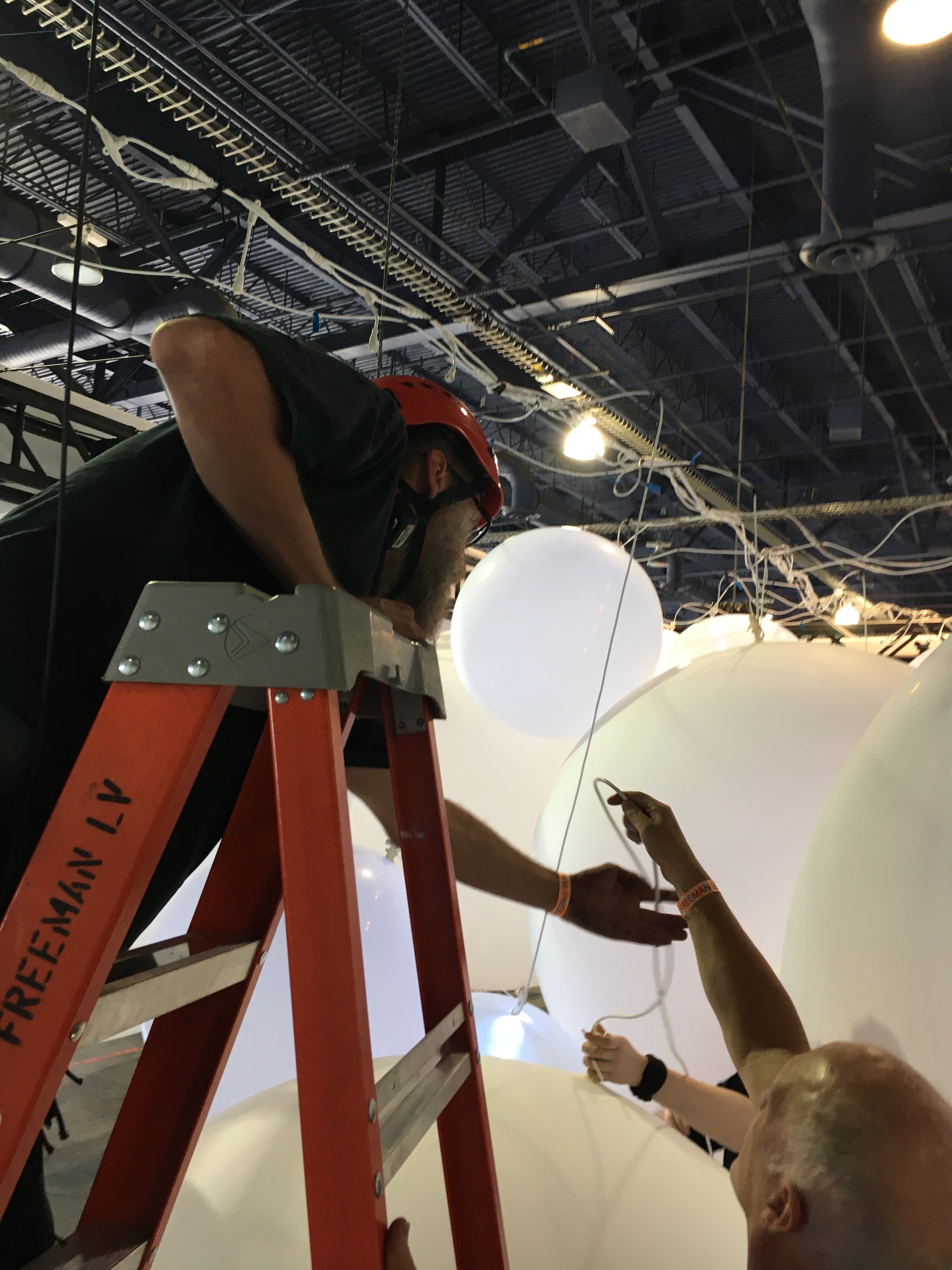 As more balloons get hung, it becomes trickier to hang more.