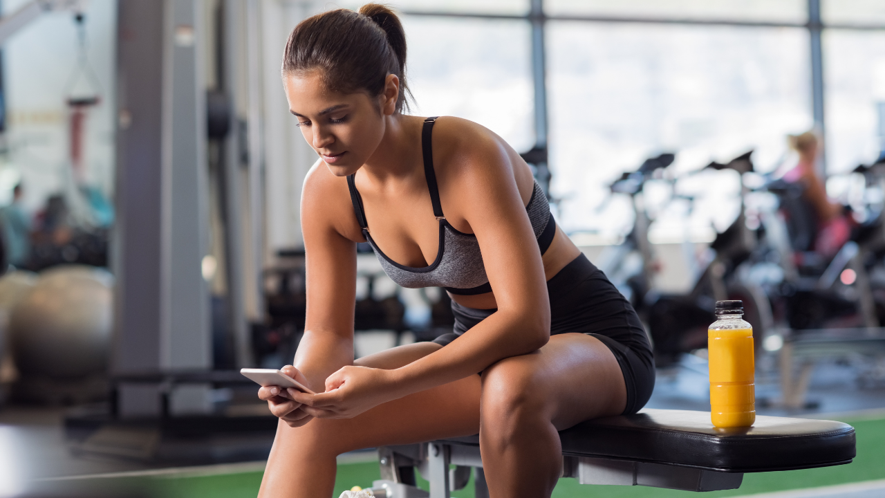In Defense Of Being On Your Phone At The Gym