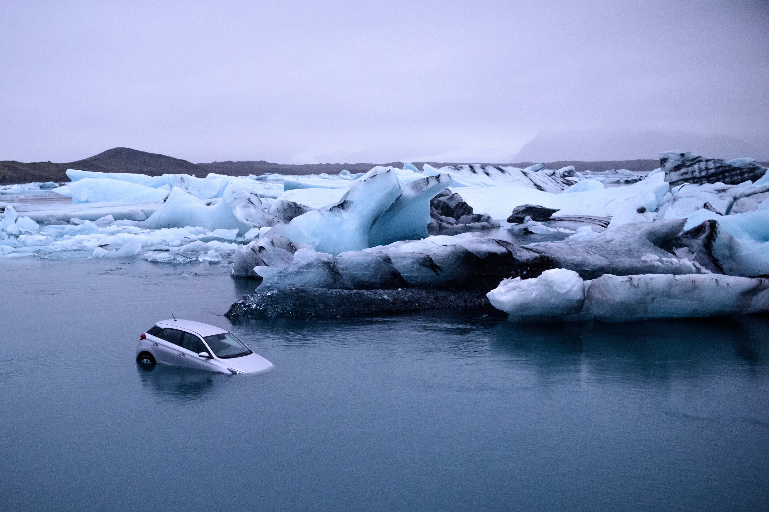 A car sinks into Jökulsárlón glacial lagoon, Iceland