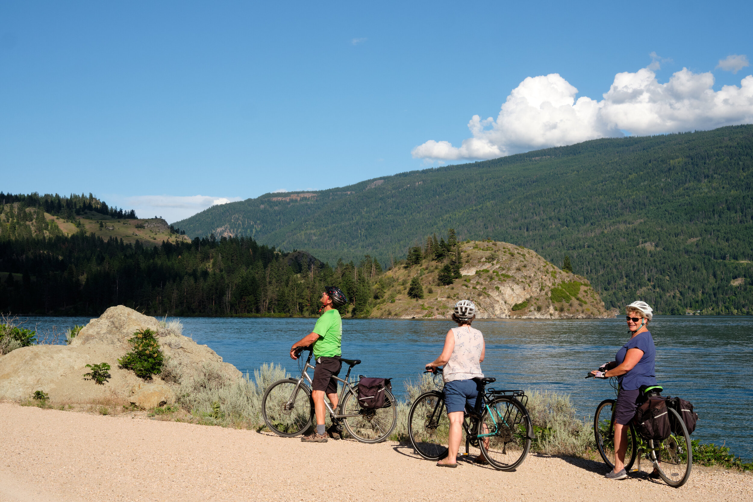 Friends on a cycling trip along Kalamalka Lake near Vernon, BC on the Okanagan Rail Trail