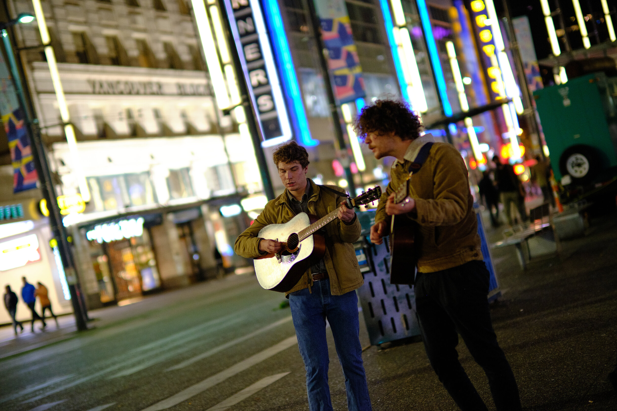 Two buskers playing guitar and singing in downtown Vancouver. Sample image from a Fujifilm XF 50mm f/1 R WR