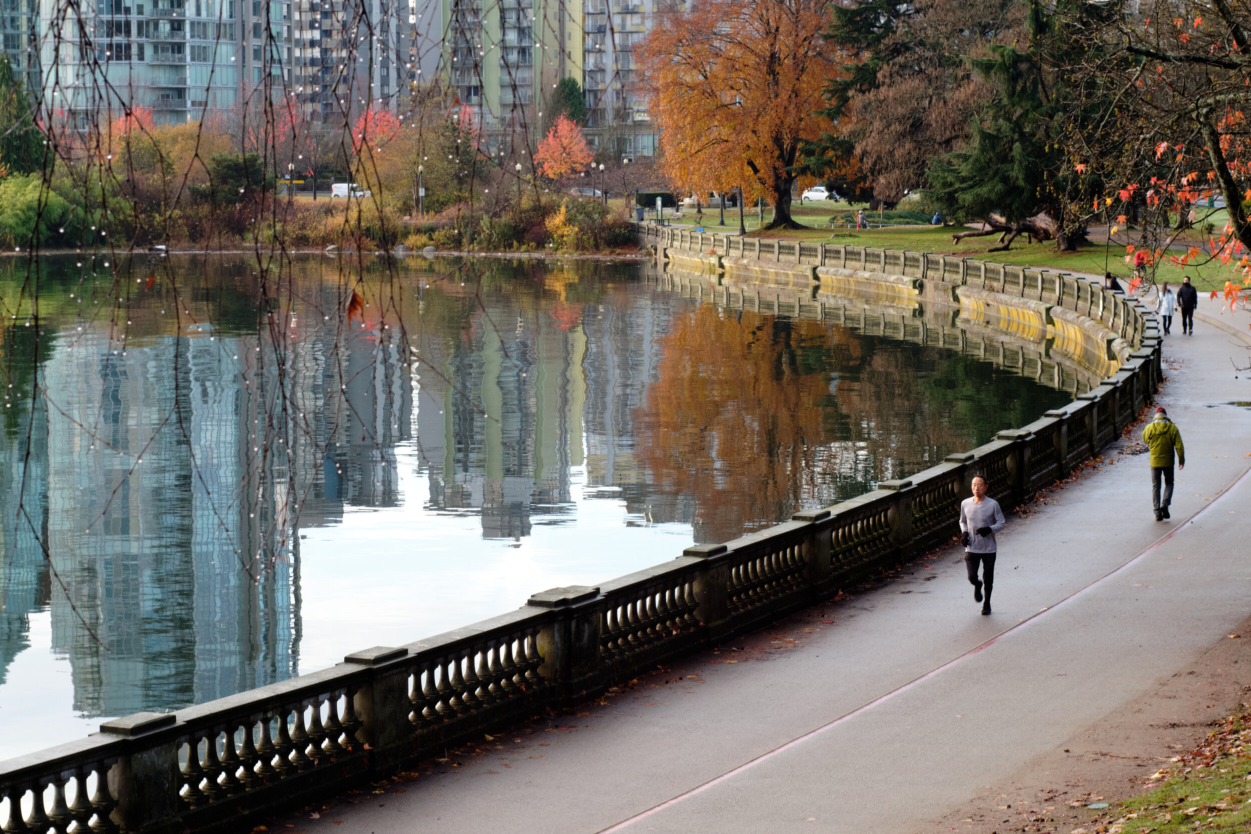 People are out on an early November morning for a run or walk along the Stanley Park Seawall in Vancouver