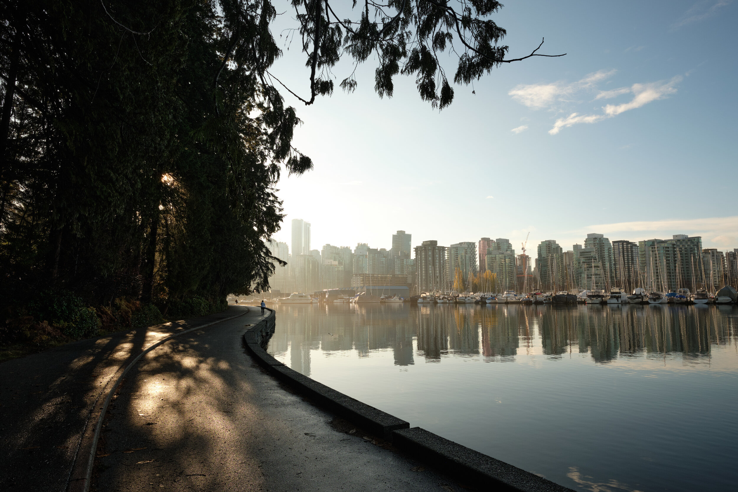 A calm and beautiful sunny morning at Coal Harbour along the Stanley Park Seawall in Vancouver