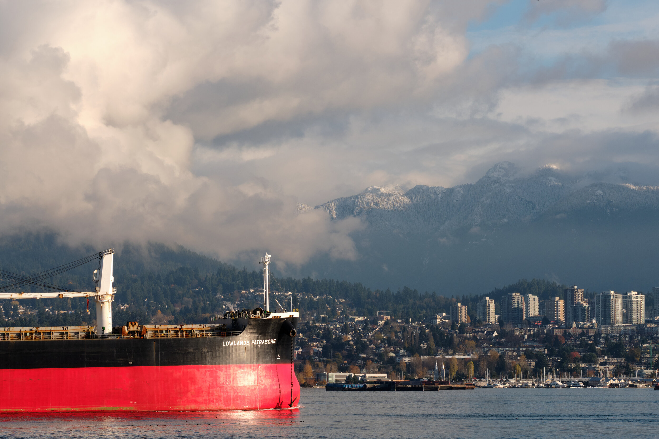 A freight ship enter the Burrard Inlet on November morning with North Vancouver seen in the background