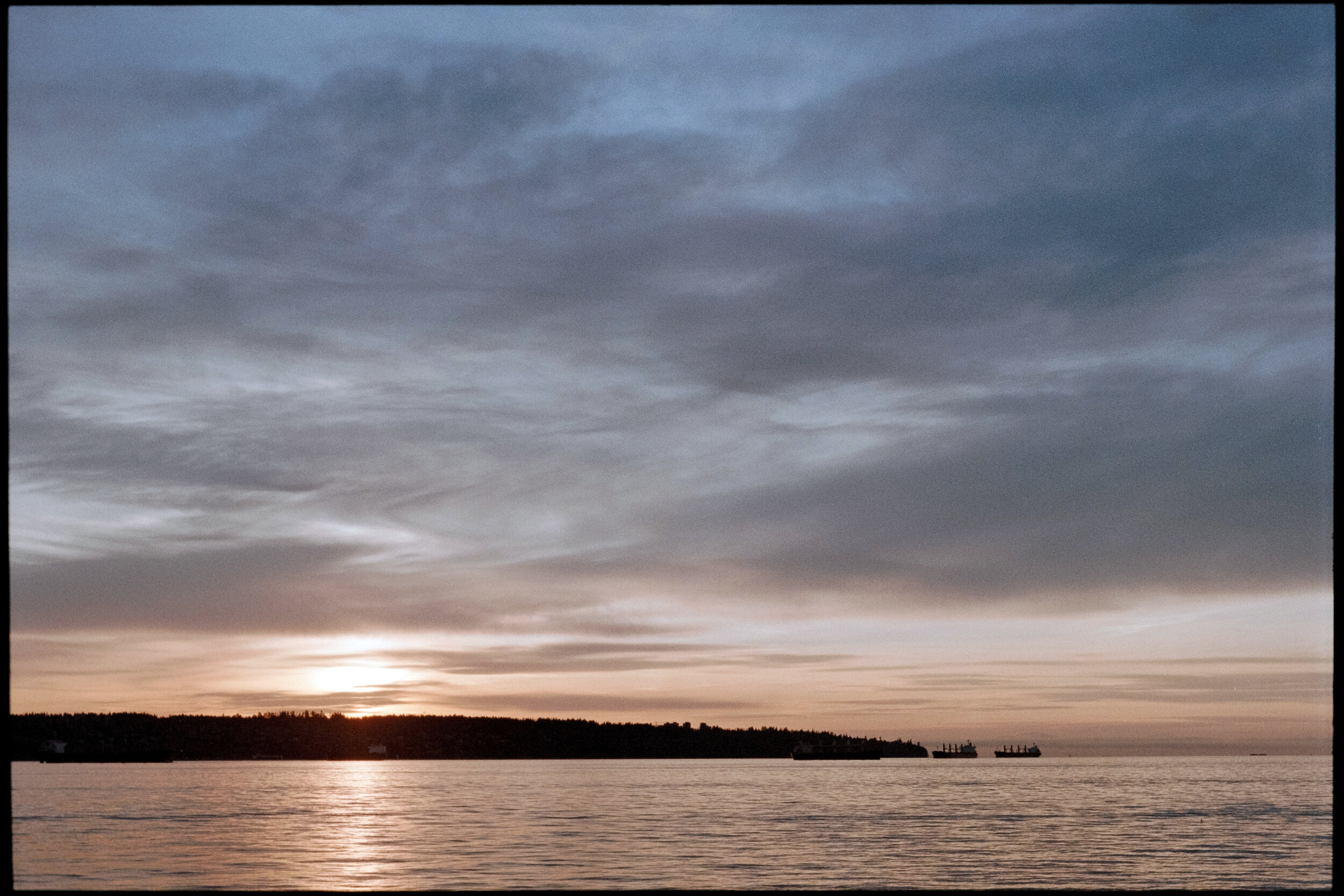 November sunset over English Bay. Sample image from a Nikon EM and Kodak Gold 200