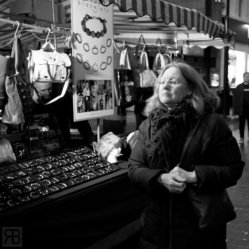 I used a small LED light that was attached to the market stall for this shot, noticed people passing through the light and figured it would be better than no light at all.. its was getting dark!