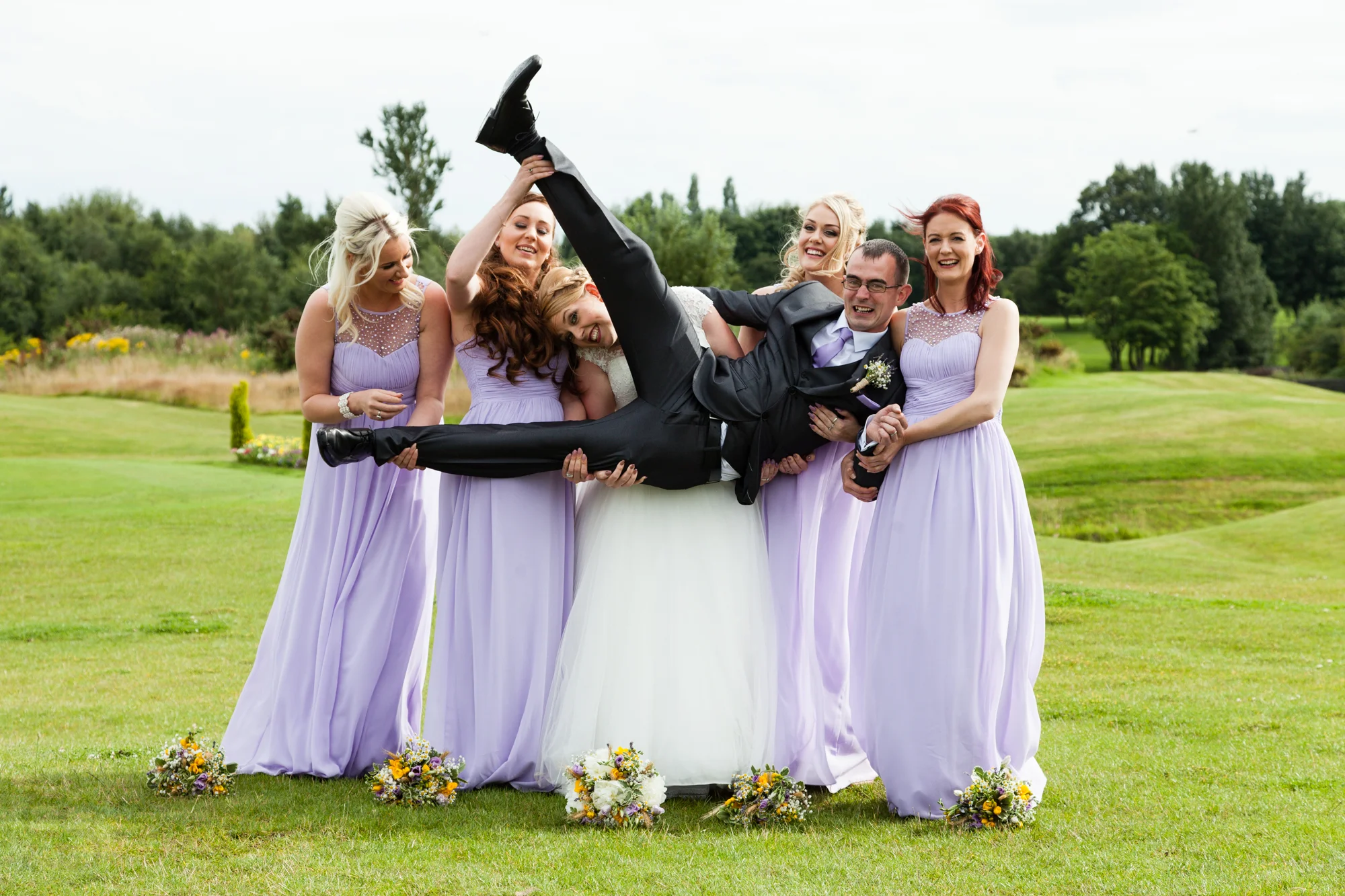 Bride, Groom and Bridesmaids at a wedding. 