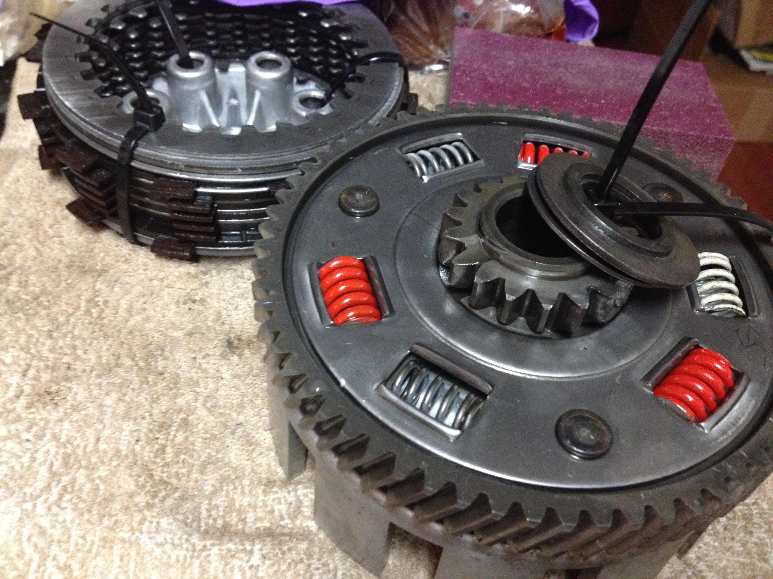 Clutch discs in background ziptied, clutch baskets/bearings in front