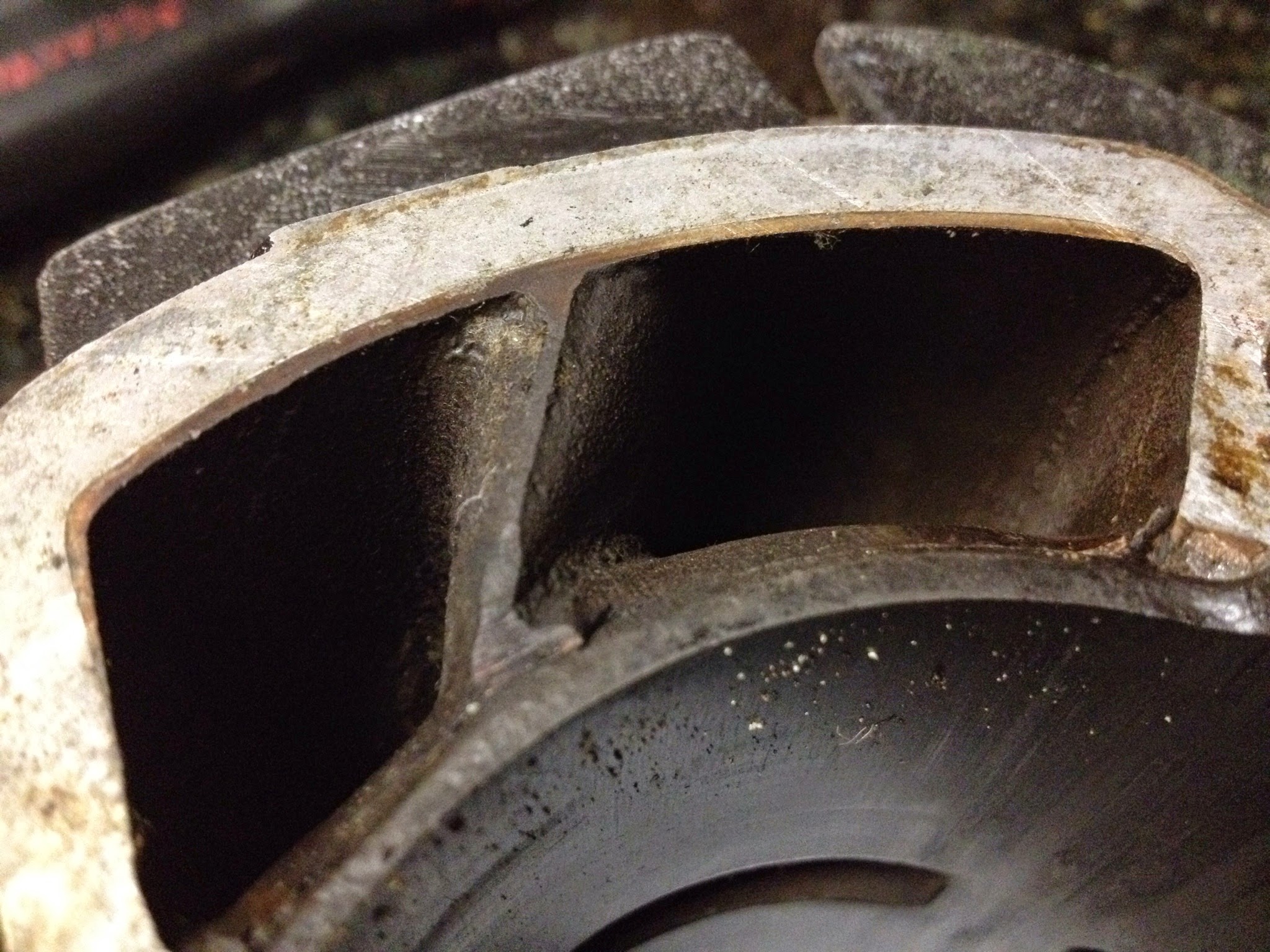 Why port/case matching helps. The person before me filed down the center divider to smooth air flow. 