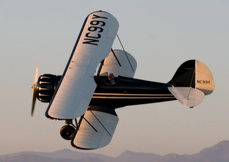 The B&W Biplane in flight over Hollywood.
