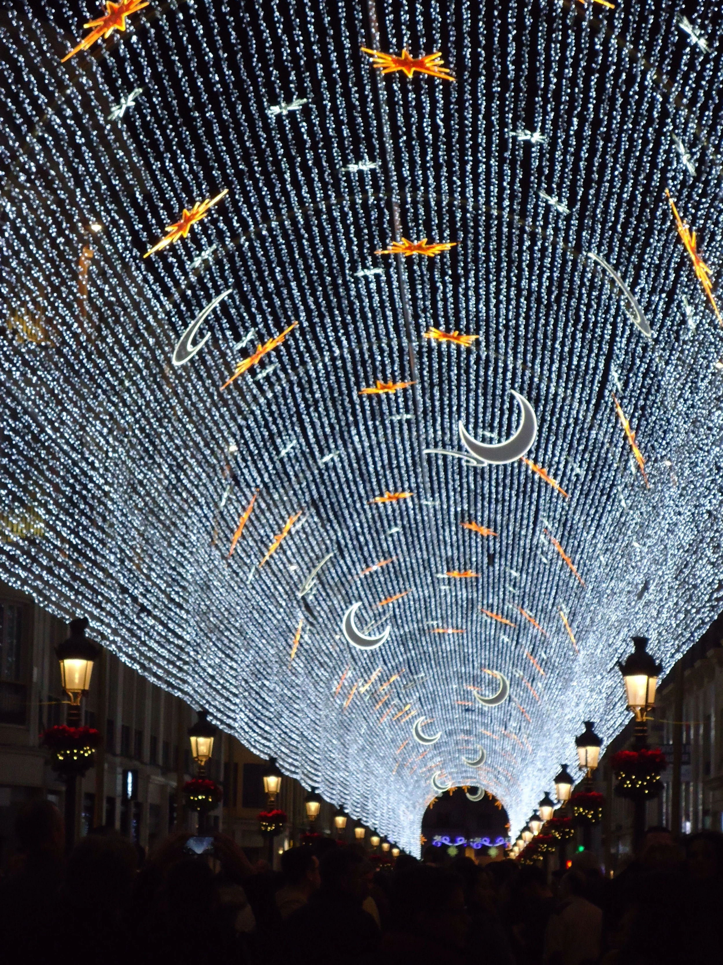 Canopy of lights, moons and stars stretching the full length of Marques De Larios 