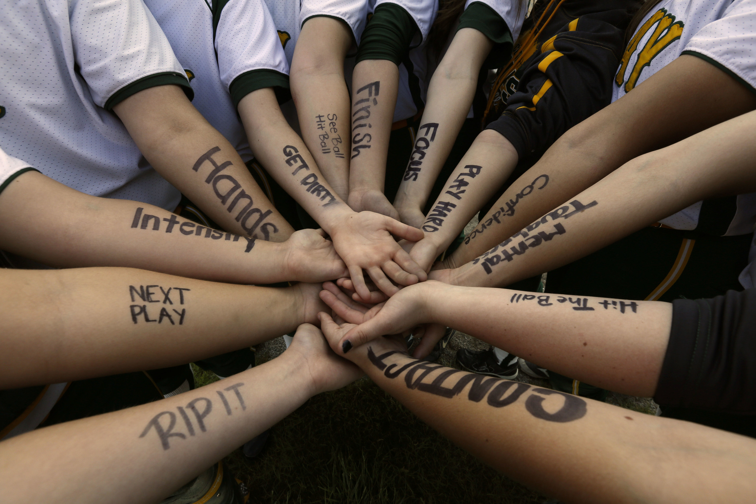   Clay High School softball players write messages of inspiration on their arms for the Div. 1 semi final softball game against Springfield at Rolf Park in Maumee, Ohio. Clay advanced to the finals.&nbsp; ©Toledo Blade   The how and why of it:&nbsp; 