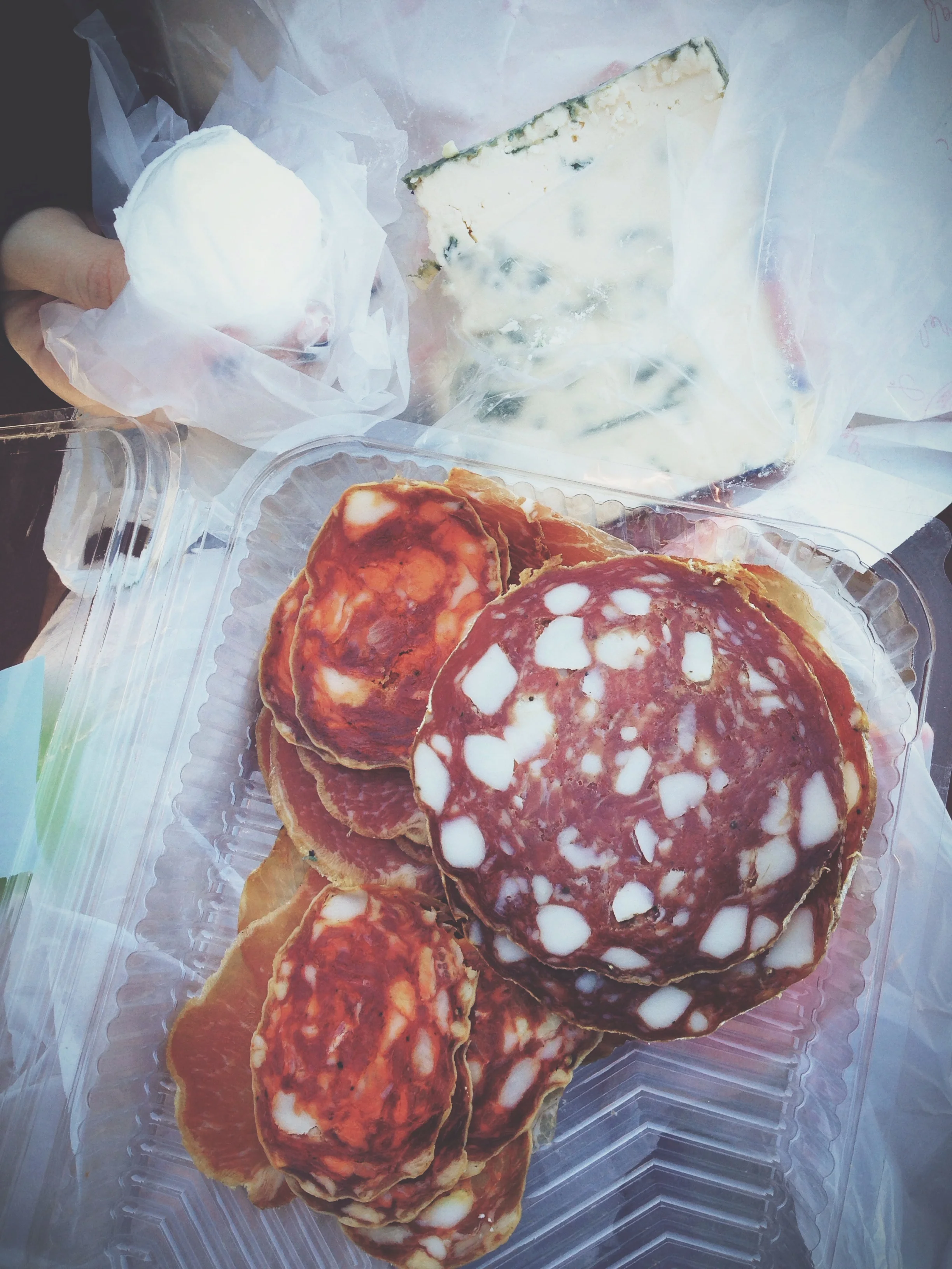 Salami, gorgonzola, and mozzarella on the beach in Ventimiglia, Italy.