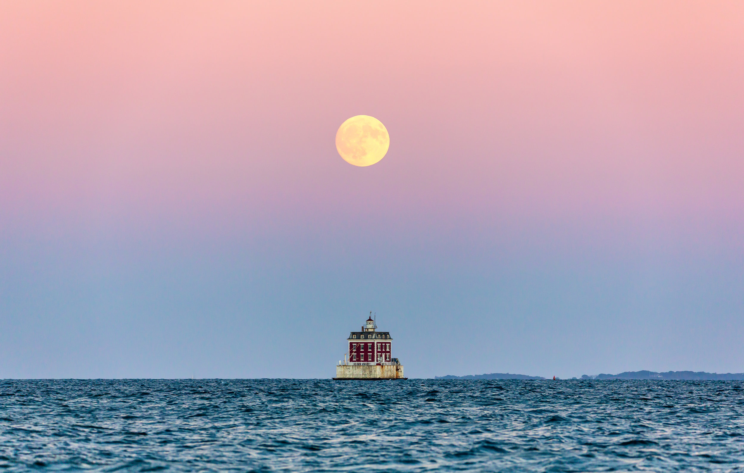 Ledge Light under a full moon.