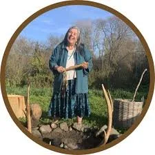 Rammaytush Elder Cata smiling in a native plant garden