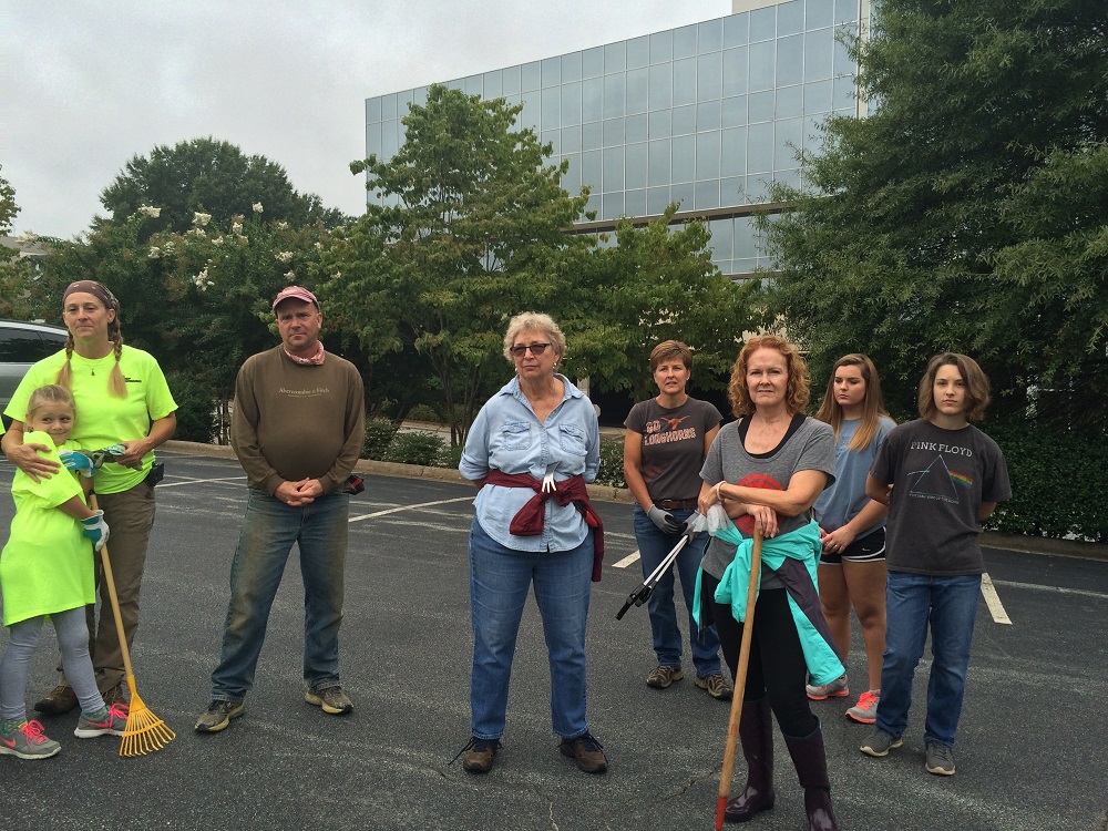  Part of the group listens to safety instructions before heading out to the cleanup site. 