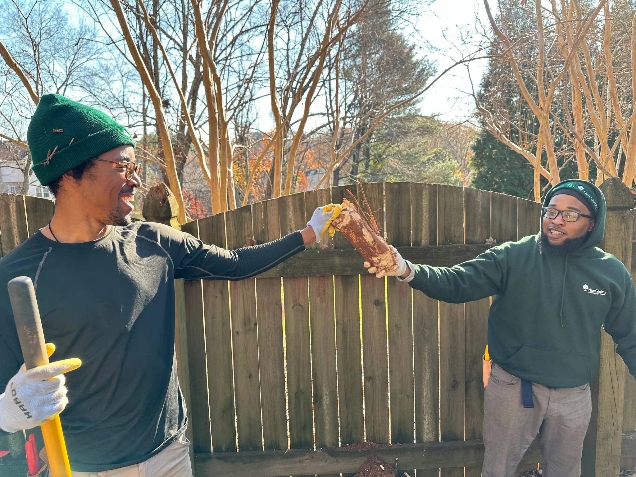 Jimmi and Brian celebrating their teamwork! It took two to tackle that tough root system. Welcome aboard, Brian&mdash;starting off with a win is the best way to kick off your time with the team!