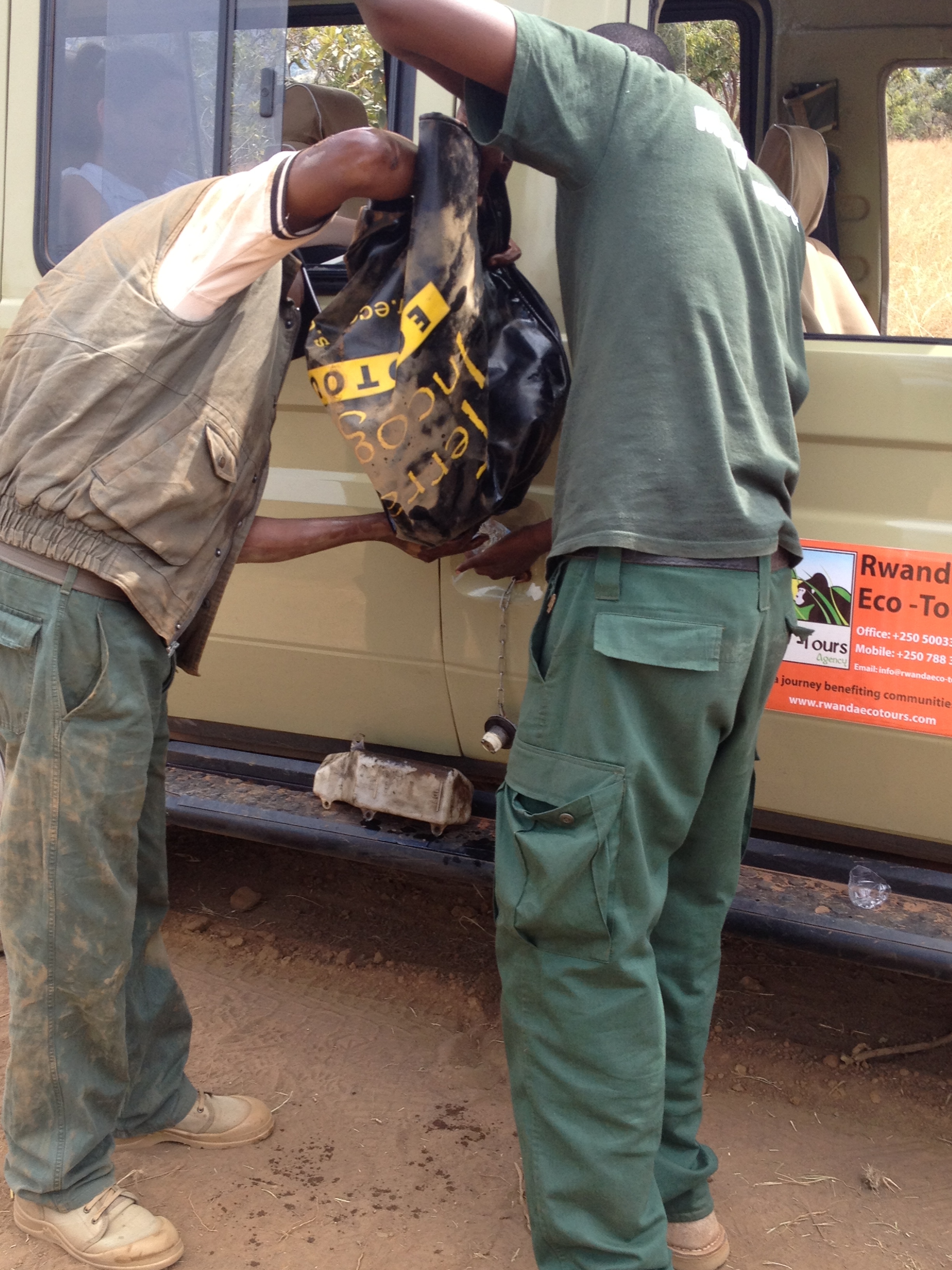 And all Yasin and Godfey had to do was rebuild the gas pump, siphon fuel out of the auxiliary tank and into the spare tire cover, and fill 'er up. We were on our way again!