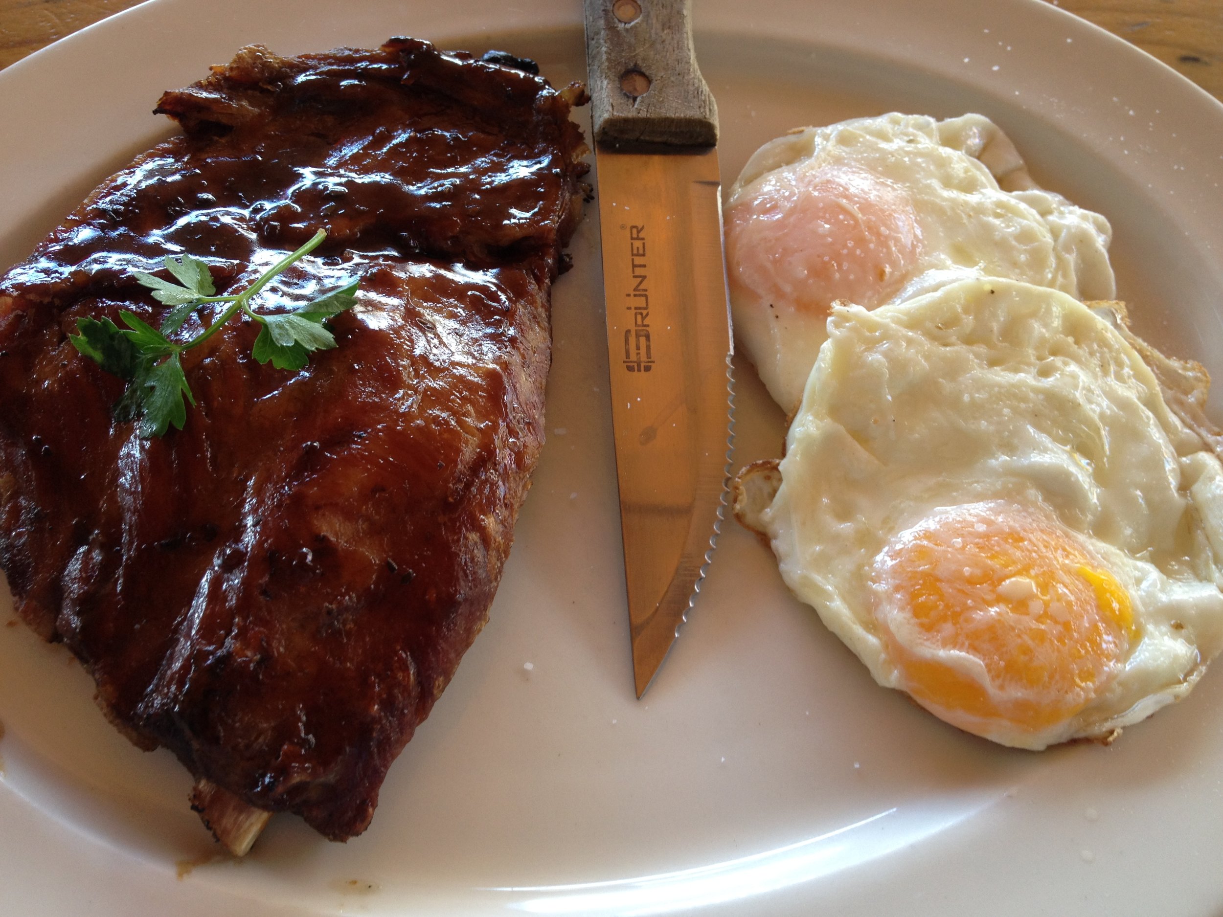 Eggs and warthog at Arnold's on Kloof, because it's where I fell in love with my wife and it's just as good as the first day she took me there.