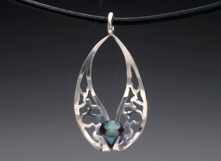Hand pierced sterline silver pendant w/ 5mm Japanese Akoya saltwater pearl.