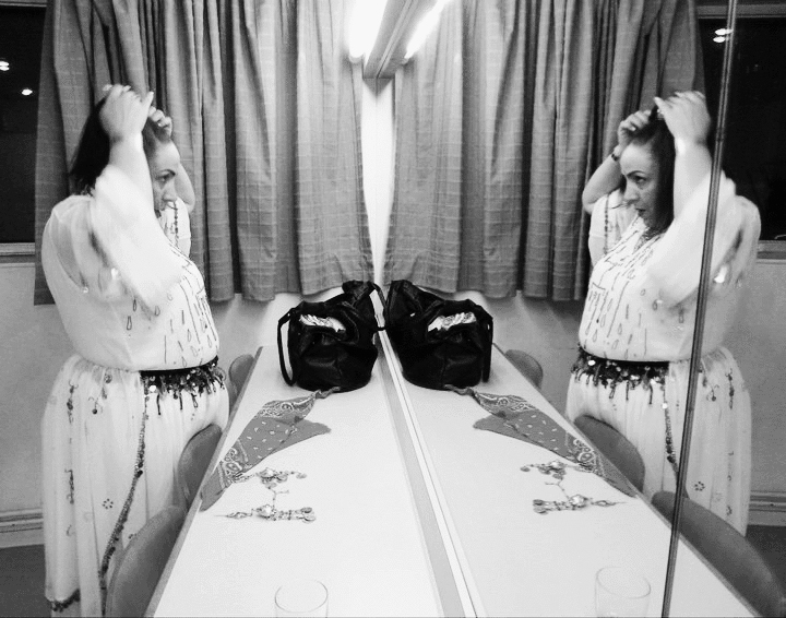 Cherifa Kersit, great amazigh voice of Morocco, is paying attention to her image before joining the stage. Nov. 2010, Amiens