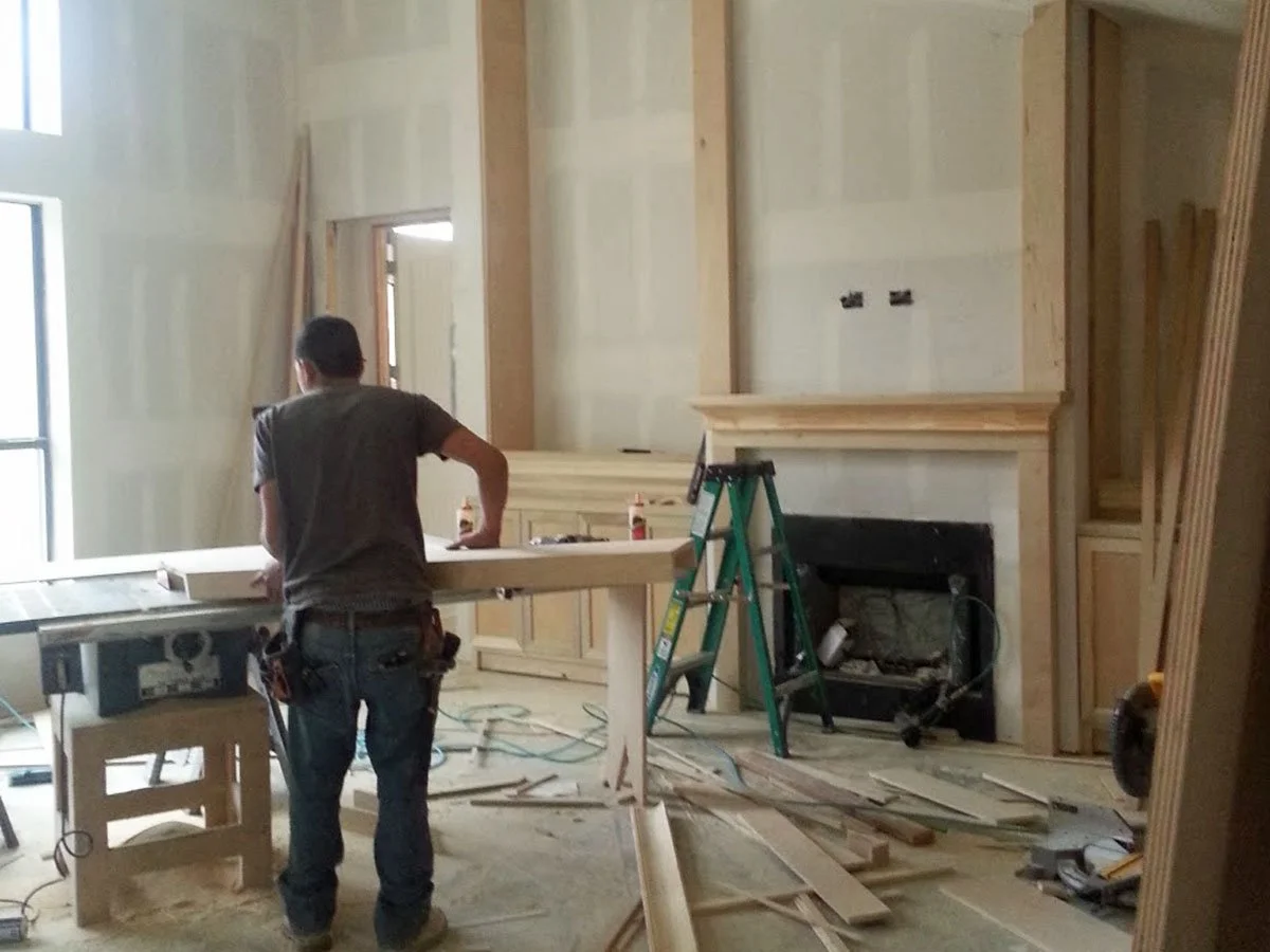 Fireplace built-ins designed early and being installed while the home is under construction.