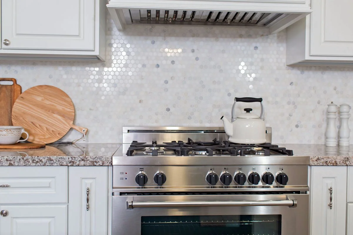 Material samples showing finish selections versus complete interior design scope including furniture and styling