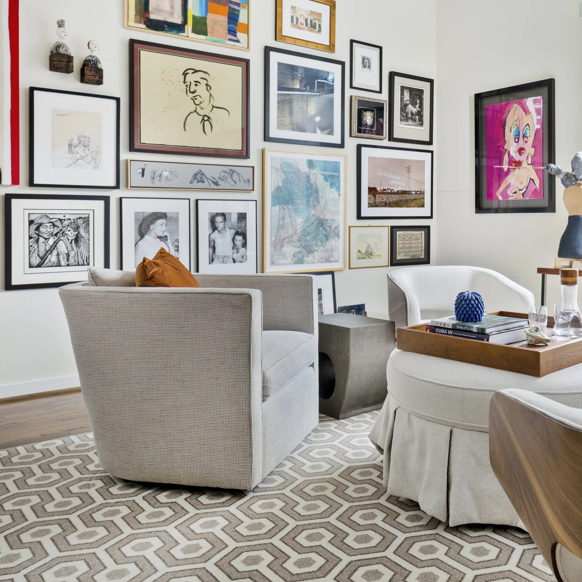 Gallery wall with modern furnishings in a Denver penthouse designed by Littleton interior design firm Jamie House Design