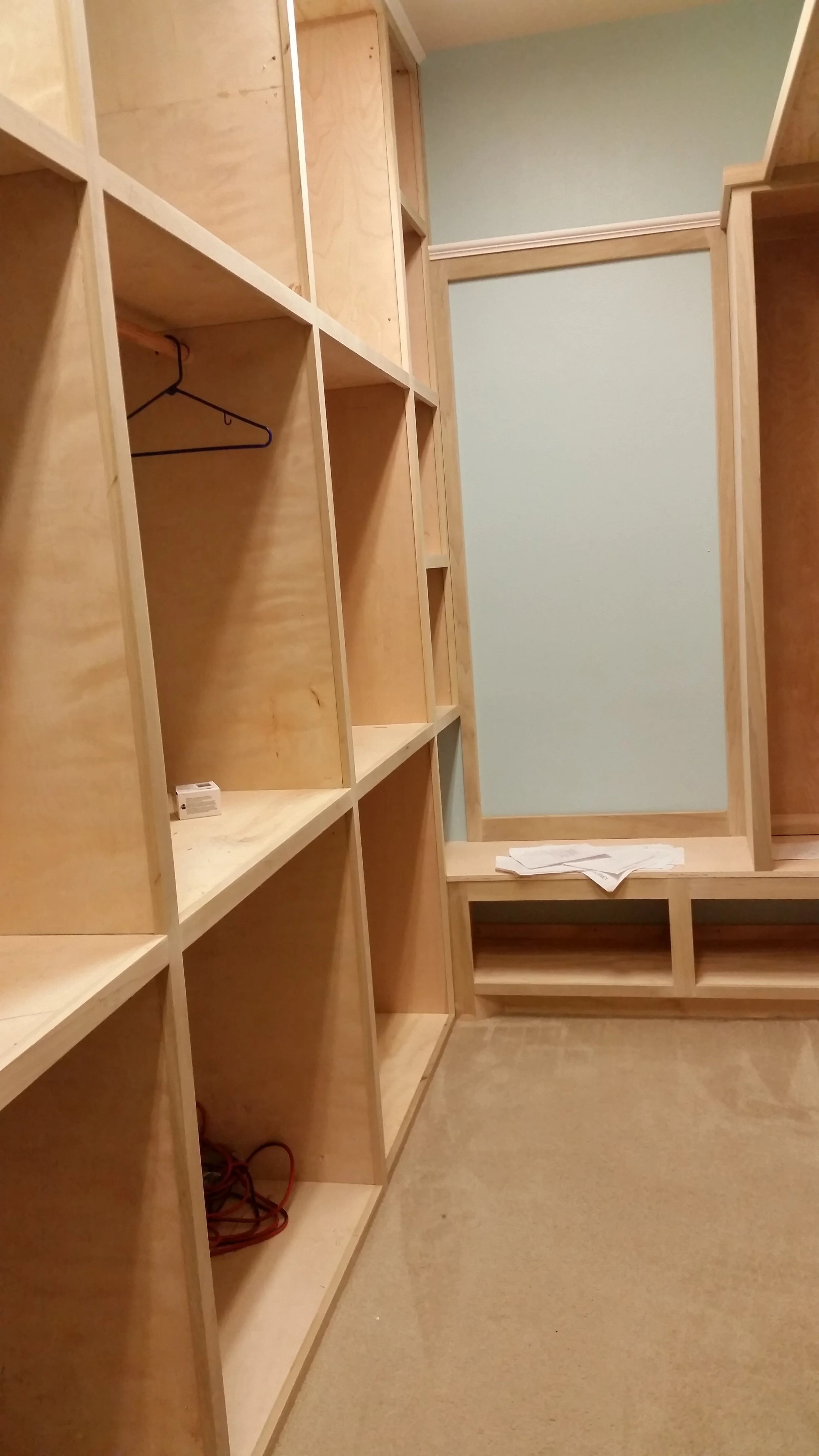 Installation image of a luxury closet designed by interior design firm Jamie House Design