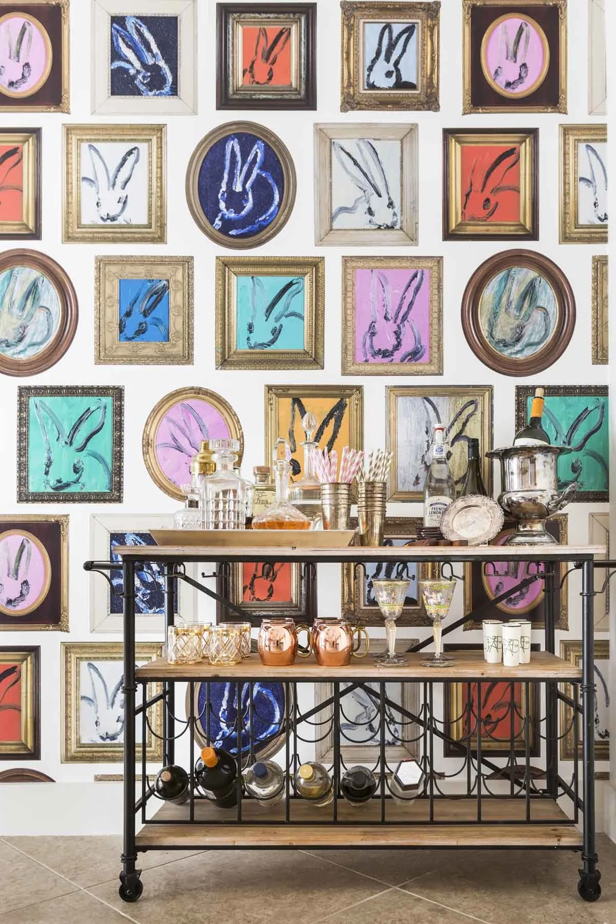 Dining room with a barcart featuring walls wallpapered in Lee Jofa Hunt Slolem wallpaper.