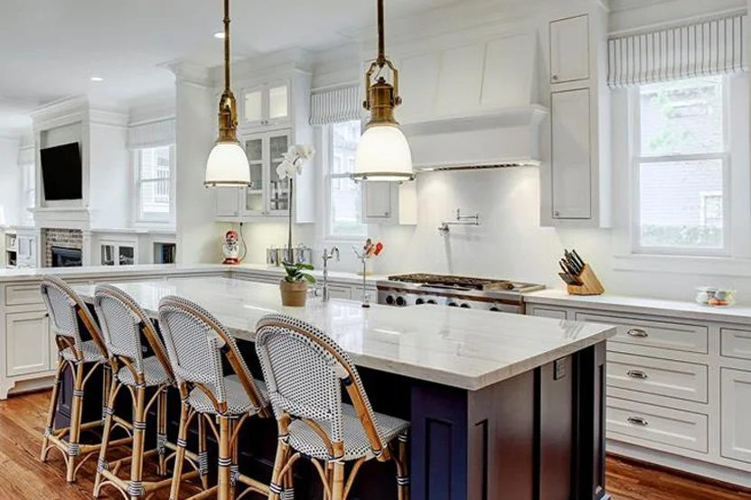 White kitchen design with navy island in house remodel
