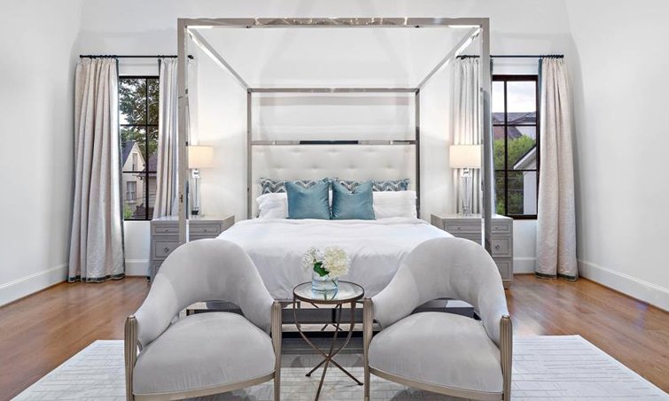 Highlands Ranch primary bedroom designed by Jamie House Design with custom furniture and bedding.