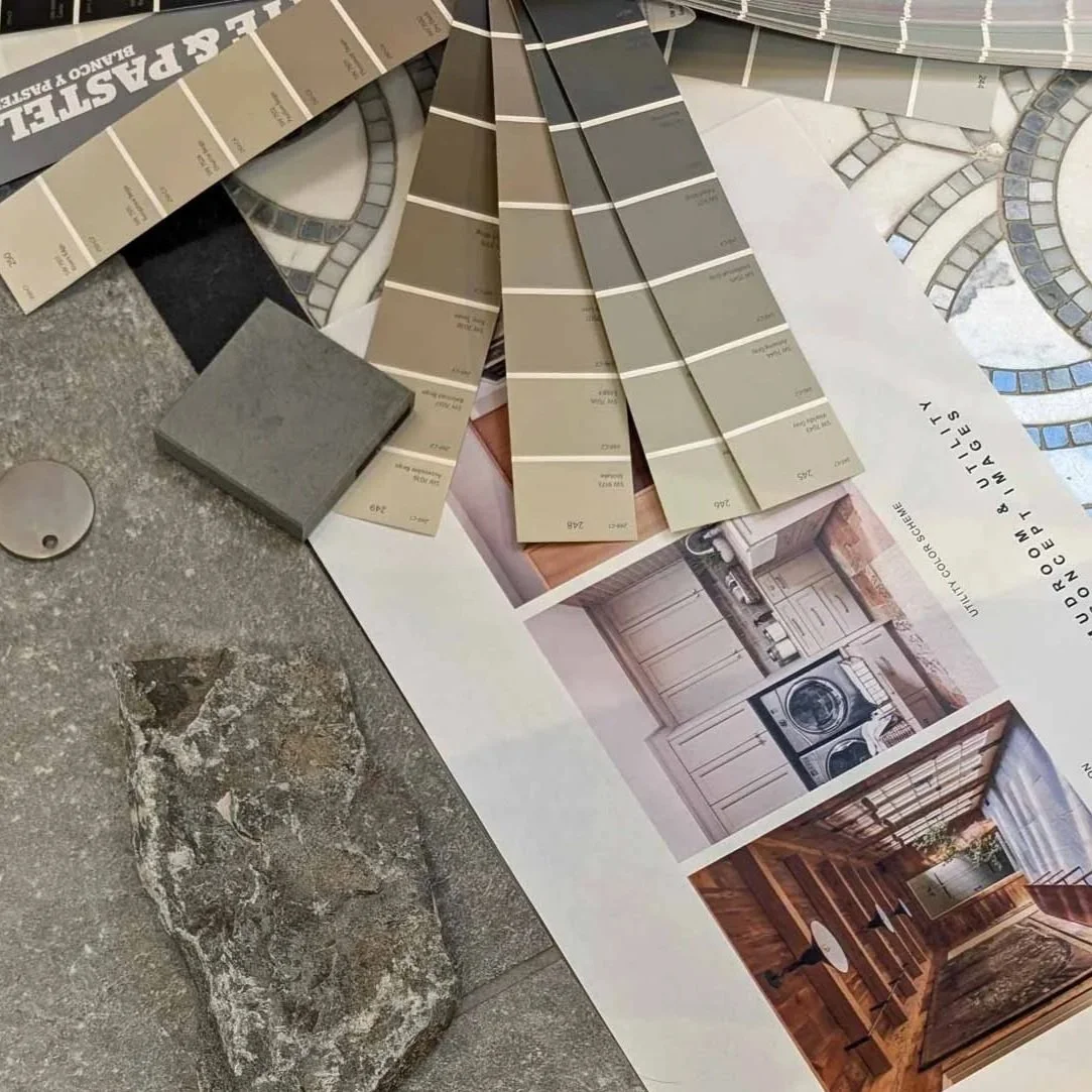 Laying out design options and materials during a Jamie House Design consultation.