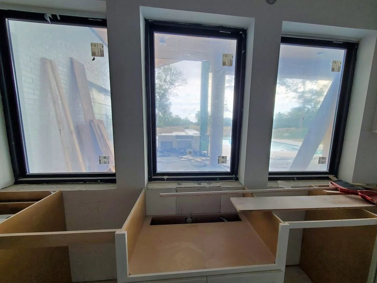 Window inspection of a new construction home designed by both and architect and interior designer.