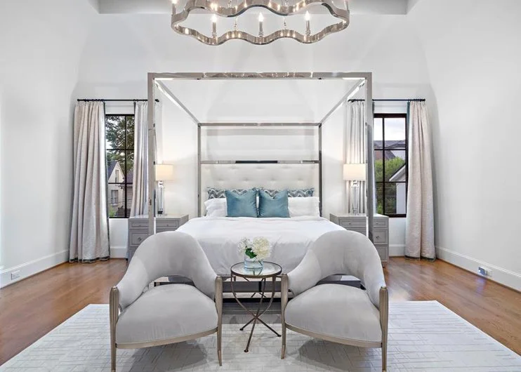 Neutral modern luxurious primary bedroom design by Jamie House Design in Backcountry Highlands Ranch CO