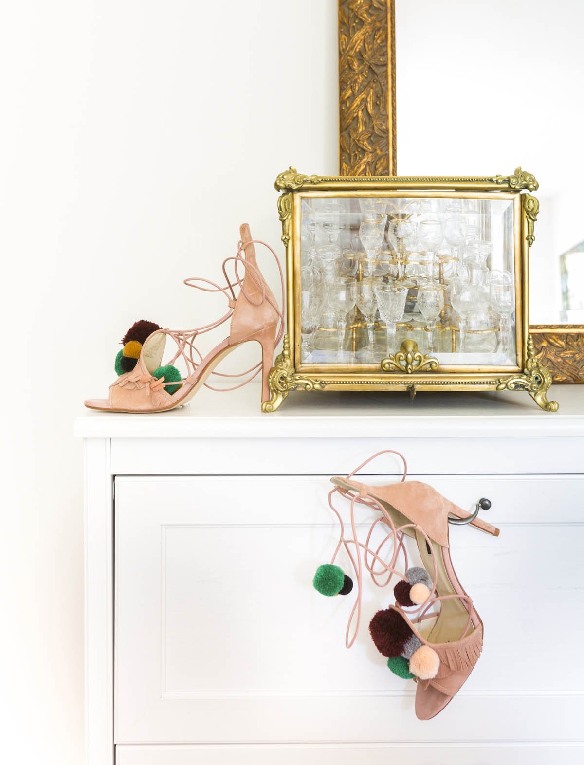 Dresser vignette in a modern primary bedroom remodel that incorporates the clients love of fashion.